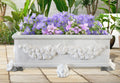 RECTANGULAR_GARLAND_PLANTER_WITH_LION_FEET_SUPPORT - Cast Stone International 